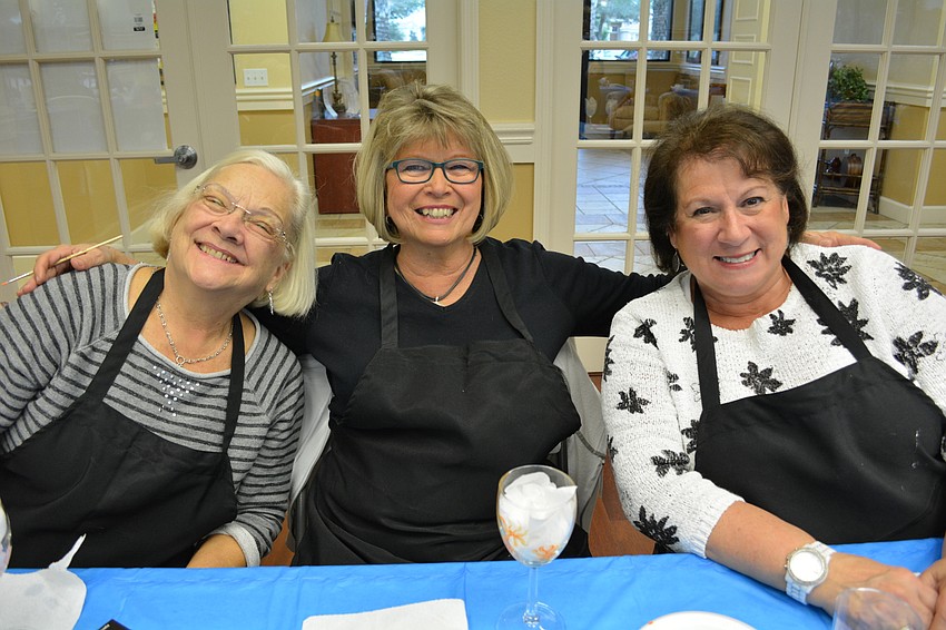 Marlen Schmidt, Vickie Winfield and Lorayne Ferguson smile as they create their glasses.