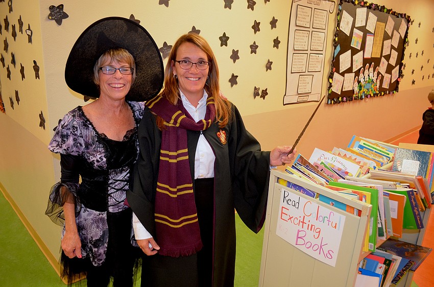 Faculty members Nancy King and Linda Applegate dress for the occasion.