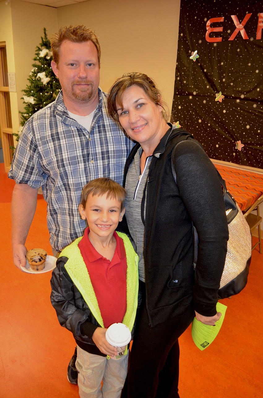 The Perry family — Gregory, Jennifer and Johnny — find snacks and hot drinks.