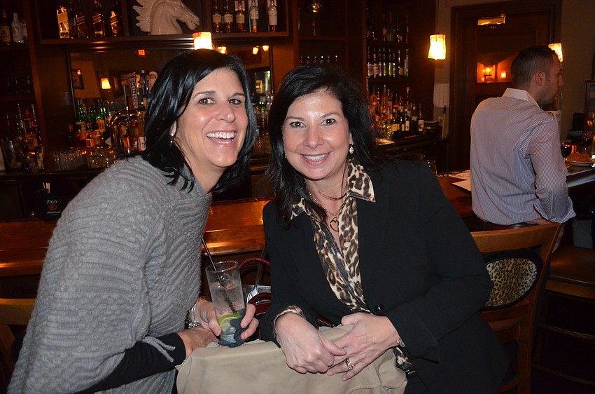 Julia DeCastro and Renee Brady enjoy laughs and drinks.