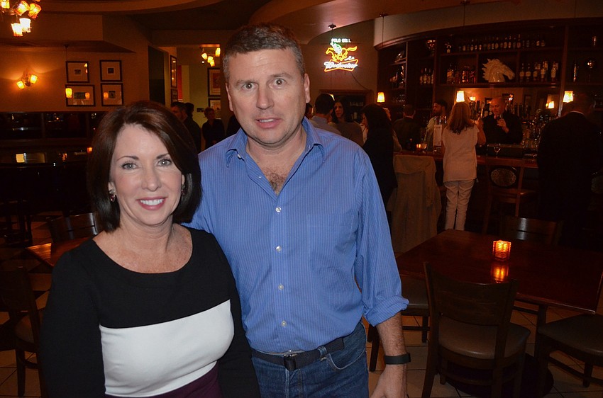 Mary Dougherty-Slapp and Marty Black enjoy time with friends.