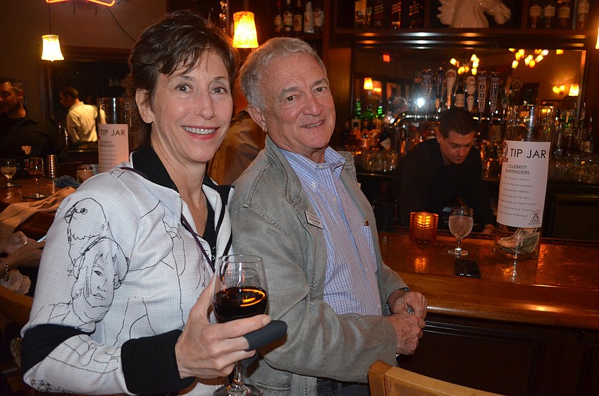 Ruth and Michael Harshman wait for their drinks at the bar.