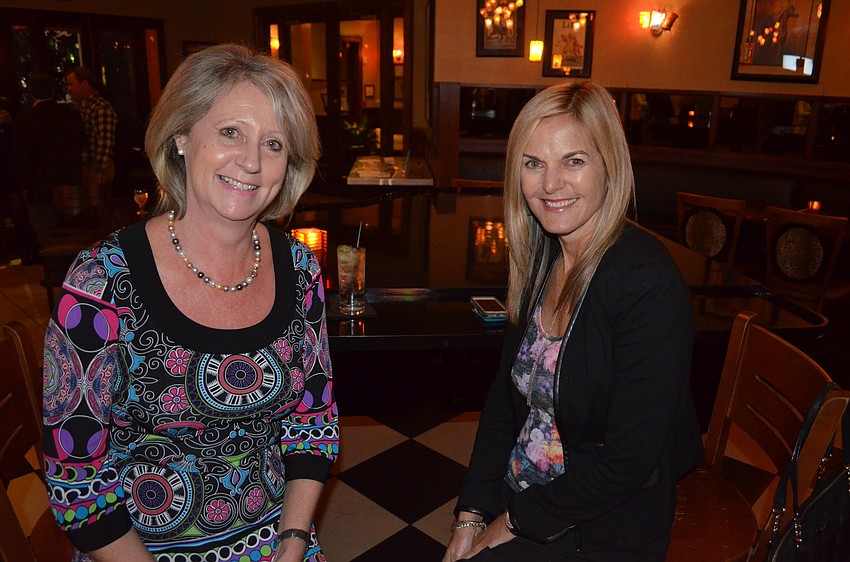 Carol Fraser and Kim Peens make new friends and chat with old ones.