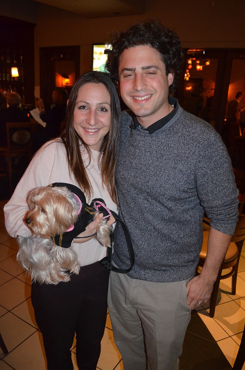 Rachel and Evan Benderson enjoy a night out with their furry friend, Ellie.