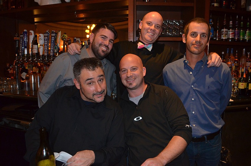 (From back left) Travis Scheuer, Tim Miller, Jamie Mirikitani, Kevin Harvey and Jim Pollet are the bartenders for the evening.