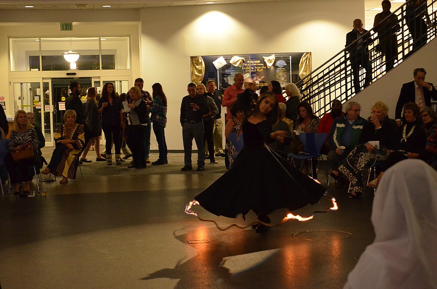 Dr. Marguerite Barnett performs a dance with her hemline on fire.