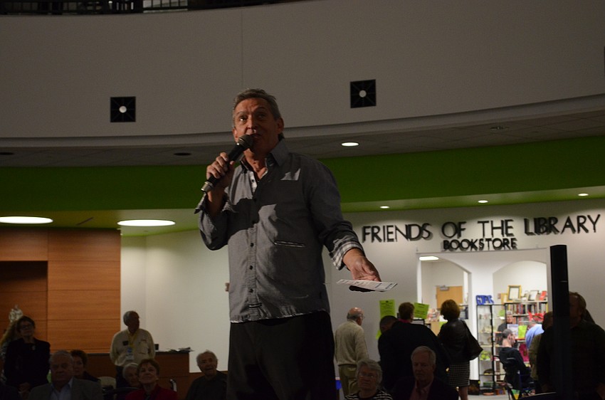 Friends of the Selby Public Library board member Kenny DeCamp addresses guests between performances.