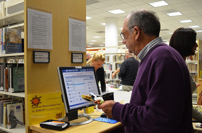 Mac McDevitt took advantage of being at the library to look up a book called 