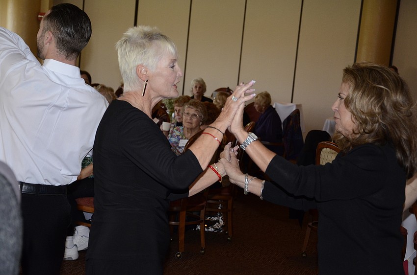 Donna Quinn, a former ballroom dance student, dances with Dodie Shuert.