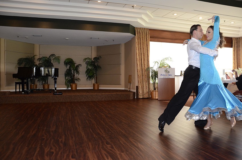 Maksym Lototskyy and Angie Fundo of Dynasty Dance Club dance a waltz.