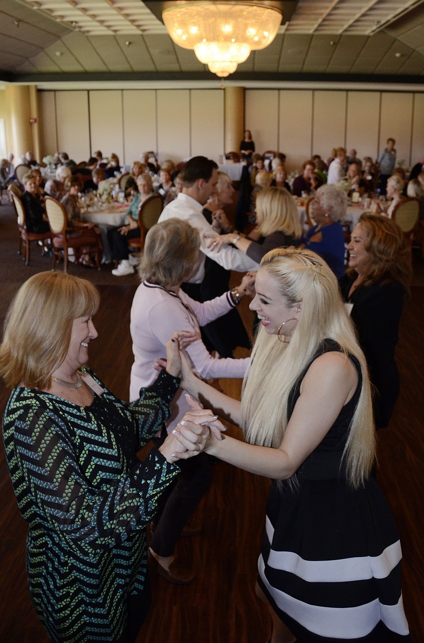 Sherry Bagley dances with Dynasty Dance Club instructor Sarah Haworth.