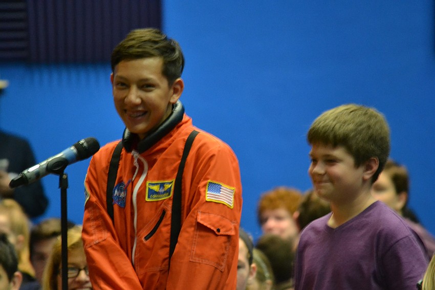 Eighth grade students T.J. Cochran and Samuel Camilli ask questions to the panel of NASA scientists.