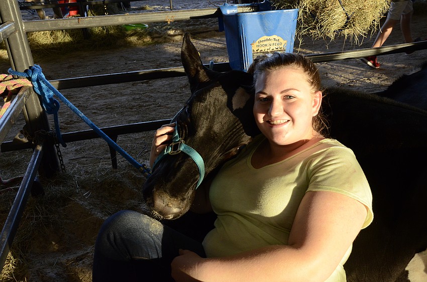 Katelyn Proper, a Lakewood Ranch High FFA member, and her cow, Momma.