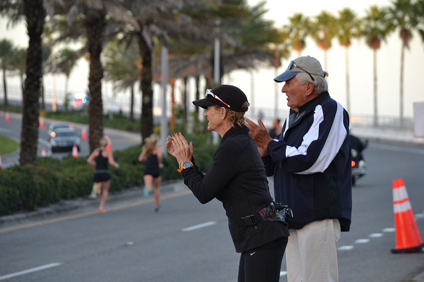 Galen and Ian Bacon cheer on their granddaughter Sage Lyons who was competing in the 13th annual Ringling Bridge Run  Saturday, Jan. 16.