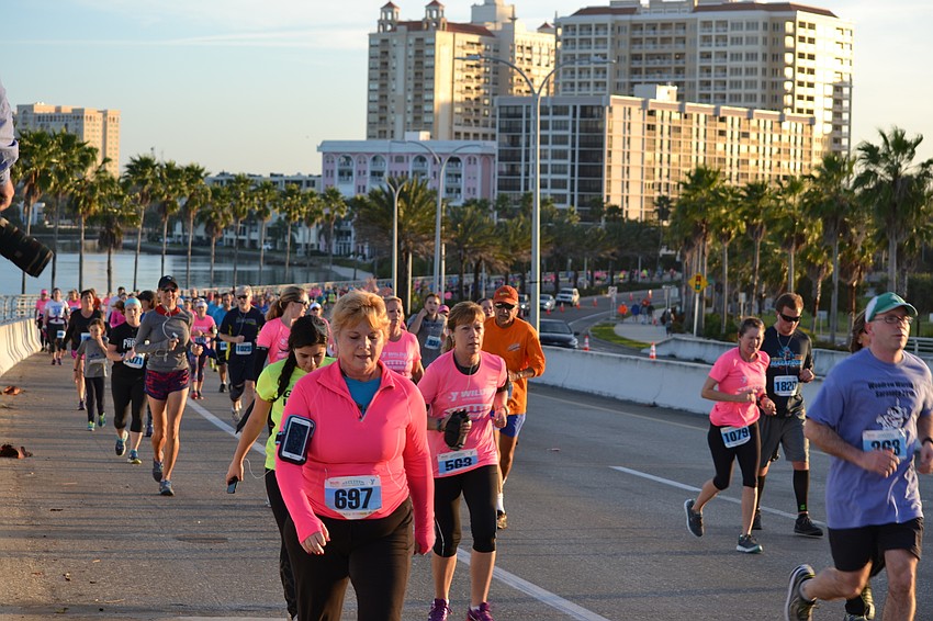 Participants climb the Ringling Bridge early Saturday morning.