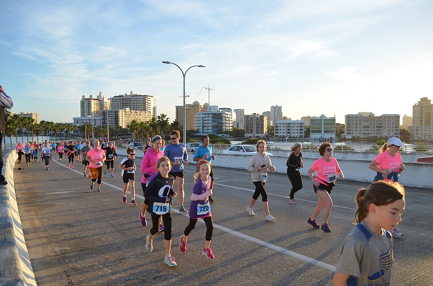 Participants climb the Ringling Bridge early Saturday morning.