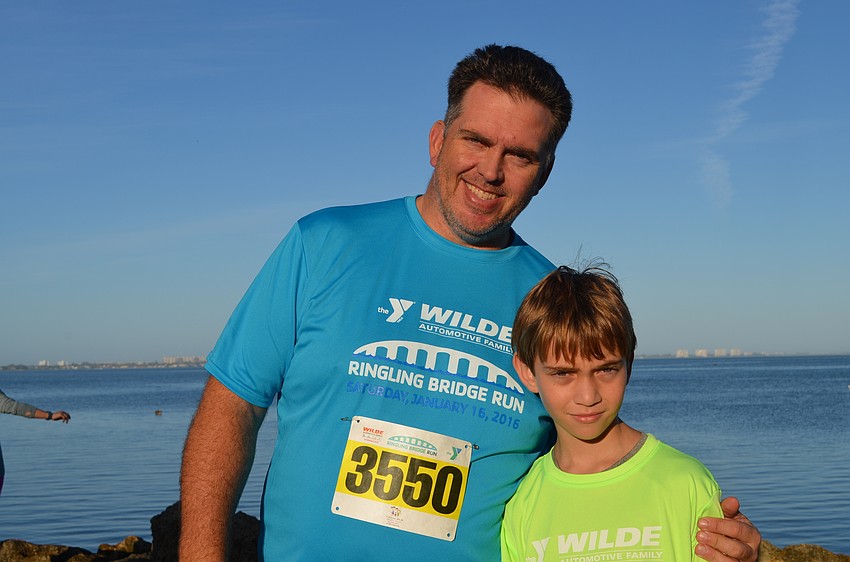 Scott Sweet and his son Peyton Sweet before running the  one-mile fun run.