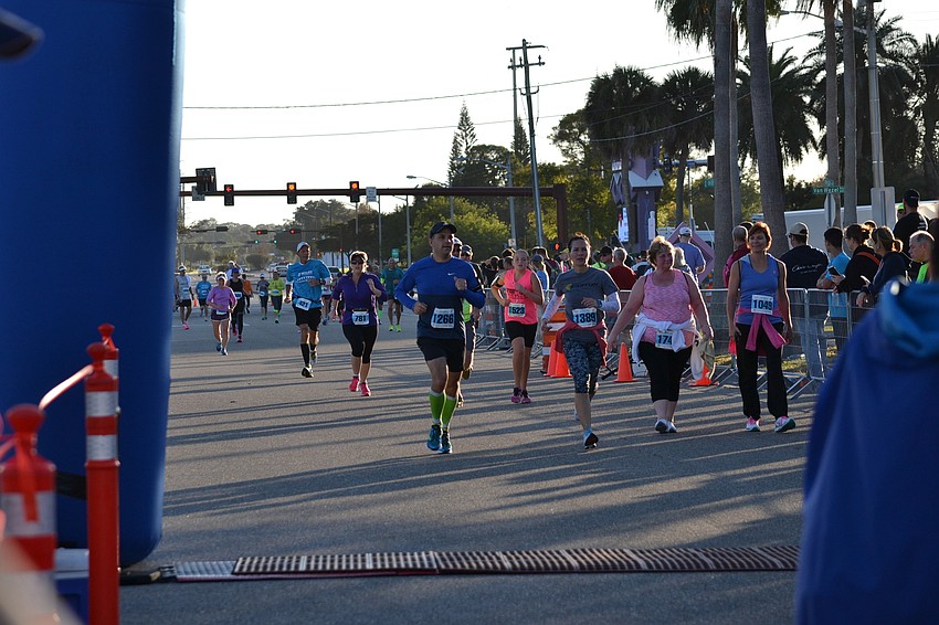 Runners rush to the finish line at the 13th annual Ringling Bridge Run.