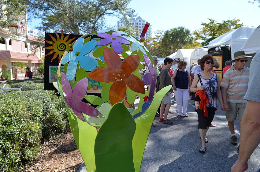 A metal sculpture from Debbie Maruccci designs stood out on the sidewalk at the 4th annual Sarasota Winter Fine Art Festival.