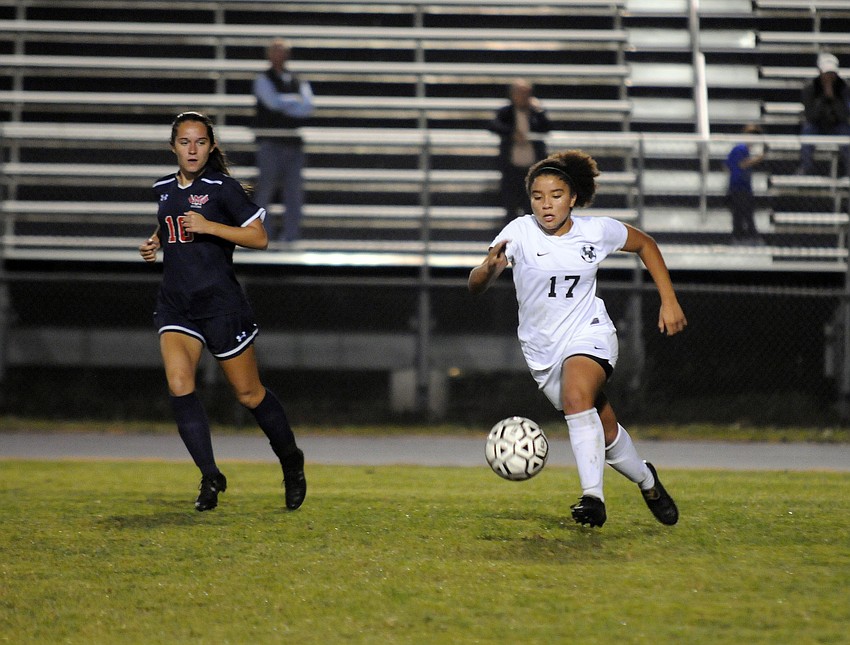 Lakewood Ranch freshman Hajar Benjoud pushes the ball up the field for the Lady Mustangs.