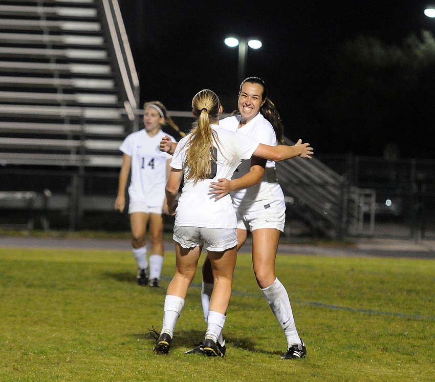 Lakewood Ranch senior defender Julia Ortiz, right, celebrates her third district championship with sophomore Sydney Wicks.