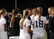 Lakewood Ranch coach Guy Virgilio congratulates his team following its 2-0 victory versus Manatee in the Class 5A-District 8 championship Jan. 15.