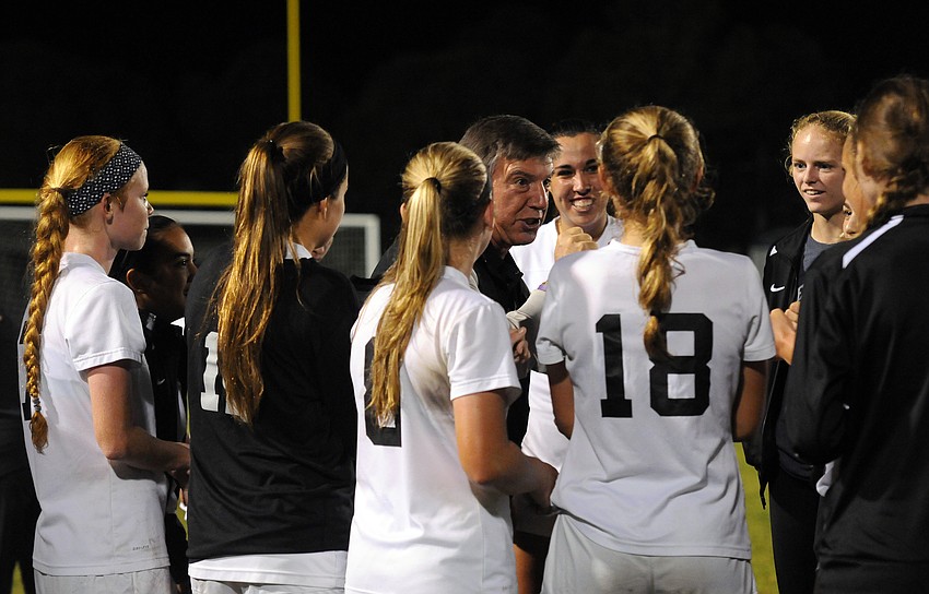 Lakewood Ranch coach Guy Virgilio congratulates his team following its 2-0 victory versus Manatee in the Class 5A-District 8 championship Jan. 15.