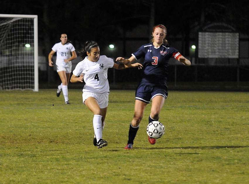 Lakewood Ranch's Madison Mirandilla battles Manatee's Brianna Blethen for the ball in the second half.