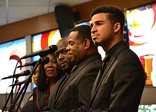 Members of the Westcoast Black Theatre Troupe performed songs between speeches.