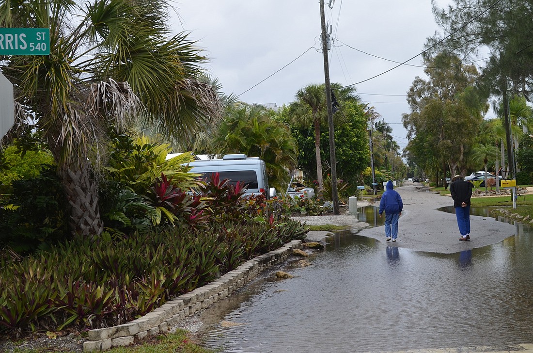Kurt Schultheis Sleepy Lagoon residents survey the area Jan. 17, after feeling the storms early that morning.