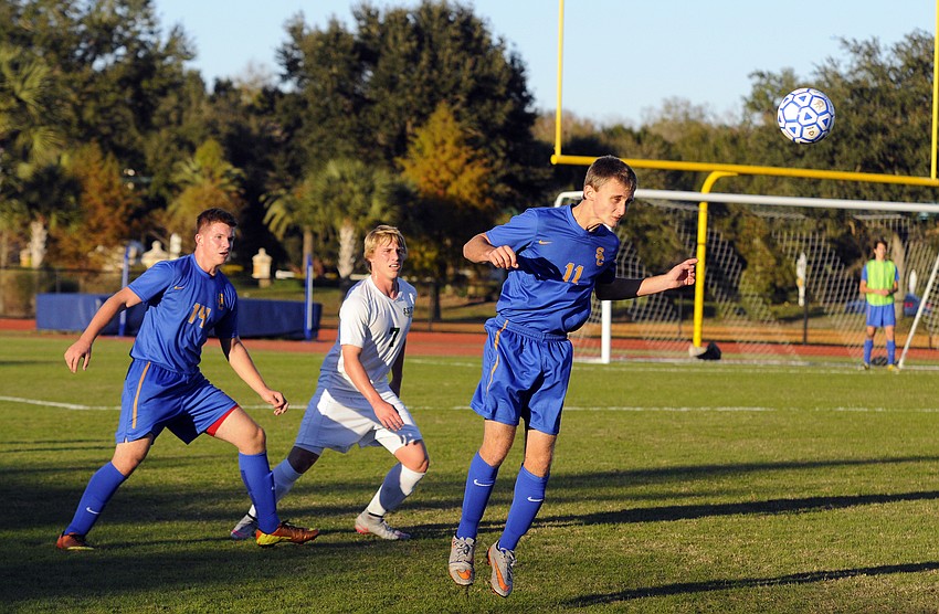 Sarasota Christian's Trey Lantz sends a header back toward the midfield.