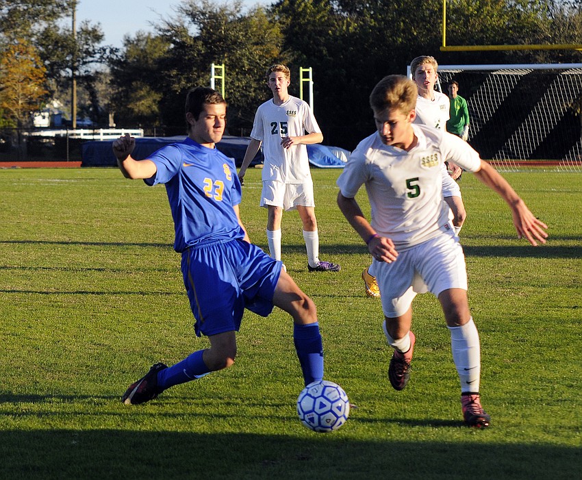 Sarasota Christian sophomore Tony Colton attempts to maneuver the ball past St. Stephen's Christopher Pennewill.