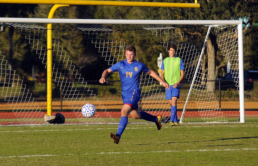 Sarasota Christian defender Jordan Schmucher dribbles the ball up the field for the Blazers.