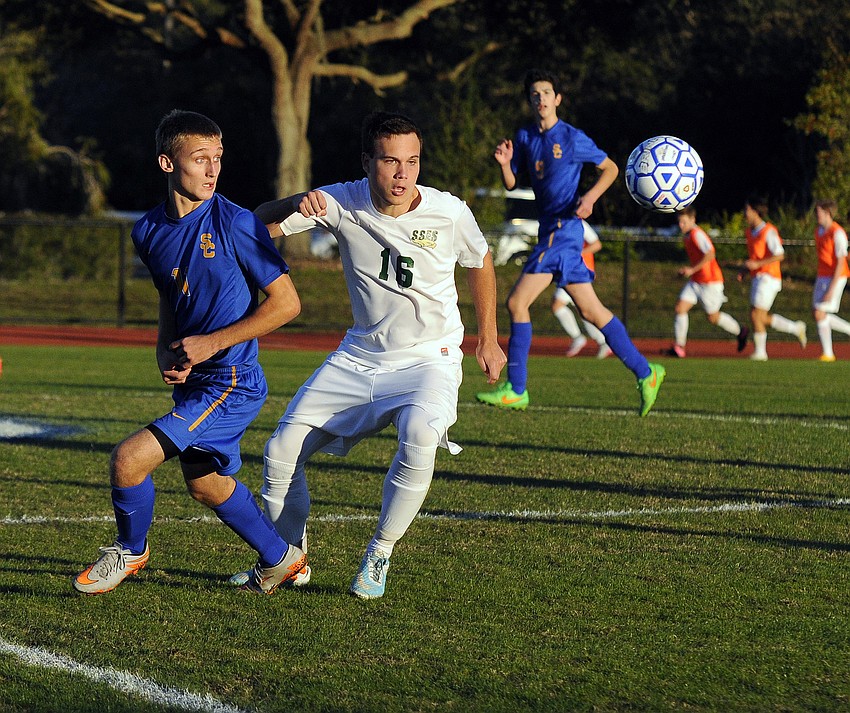 Sarasota Christian's Trey Lantz and St. Stephen's Williem Vacek battle for possession in the first half.