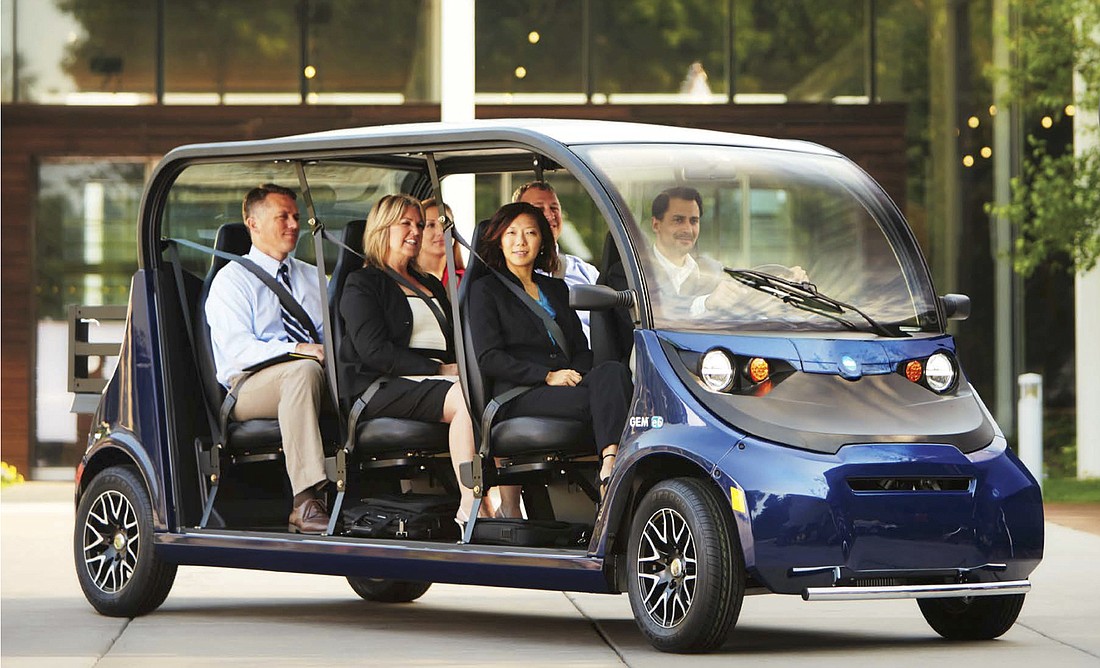 John Moran believes this six-person electric vehicle could serve as the foundation for a downtown transportation service.