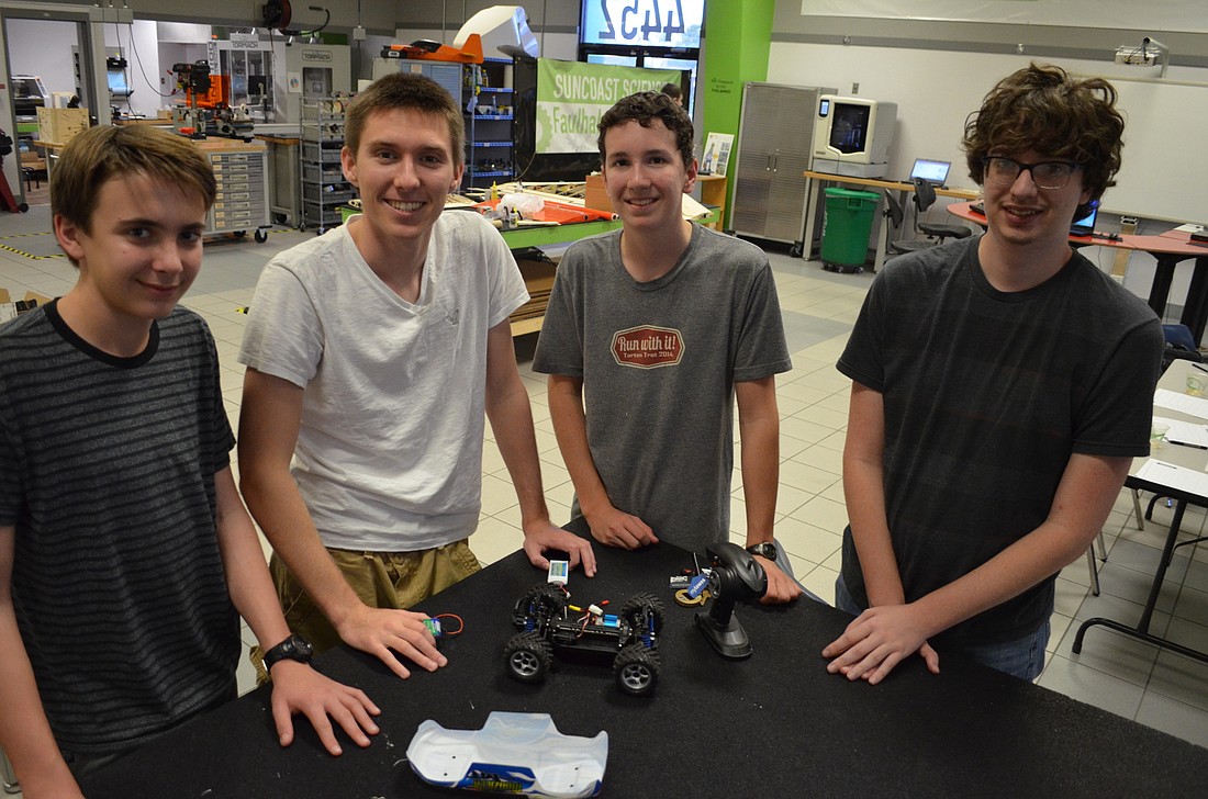 William Giraldo, Henry Tingle, Matthew Mason and Jared White are four of the seven group members organizing the Suncoast Science Center Remote Control Custome Car Open.
