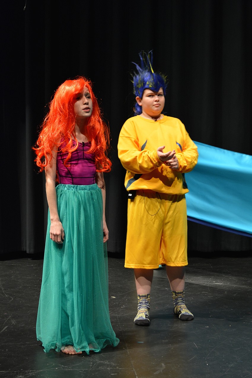 Alexia King, as Ariel, whines about her father's restrictions against seeing humans. Dru Cappar, as Flounder, offers support.