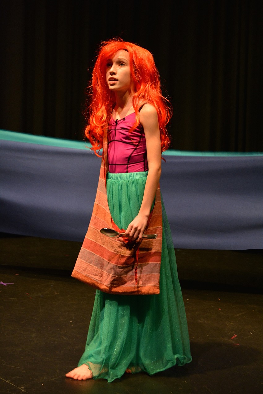 Alexia King, as Ariel, sings about her dreams to explore the human world.