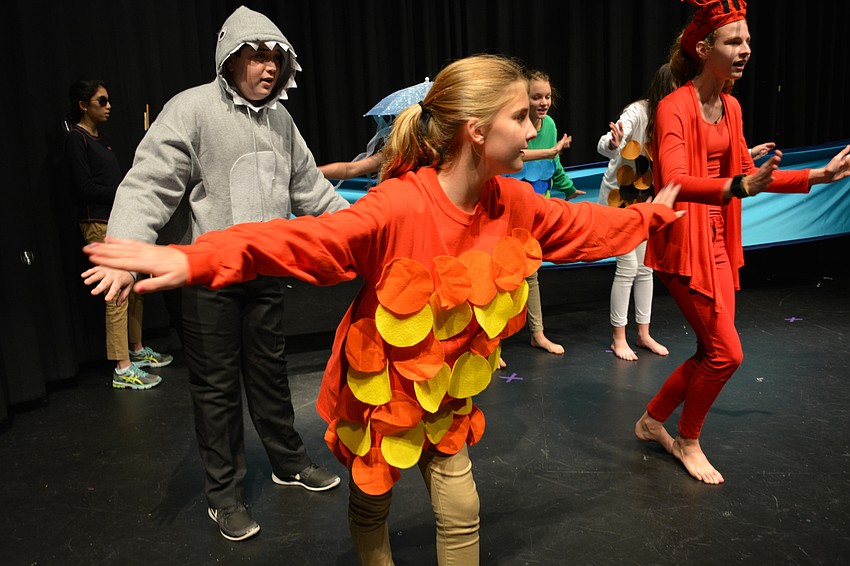 Lagoon inhabitants, including Cate Paxton, front, dance about how wonderful life is 