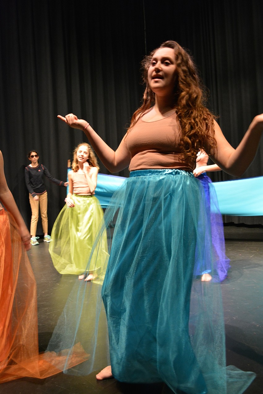 Mermaid Olivia Knego sings that Ariel must be in love because she's been so distracted.