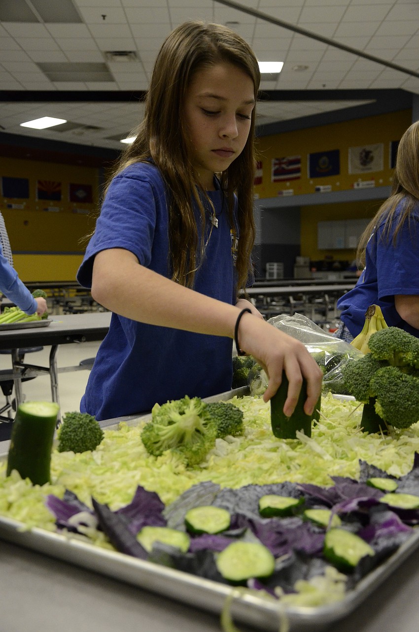Hailee Bouchard sets down the cucumber 