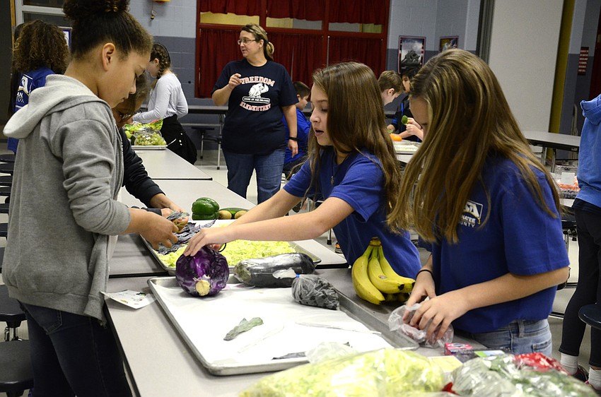 Samantha Curry, Maribel Arisa, Hailee Bouchard and Erin Galvin create their scene, 