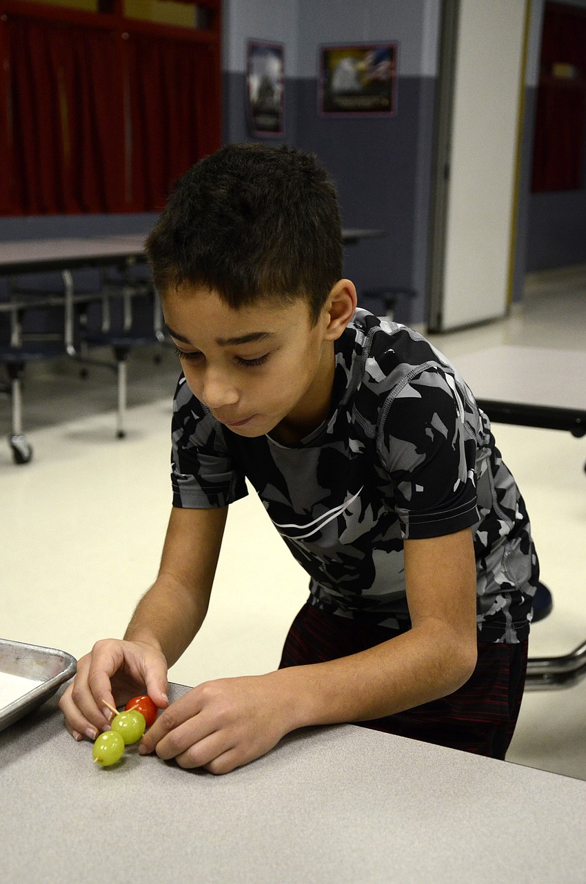 Mark Parsons works on the ants for his team's scene, Insect Army.