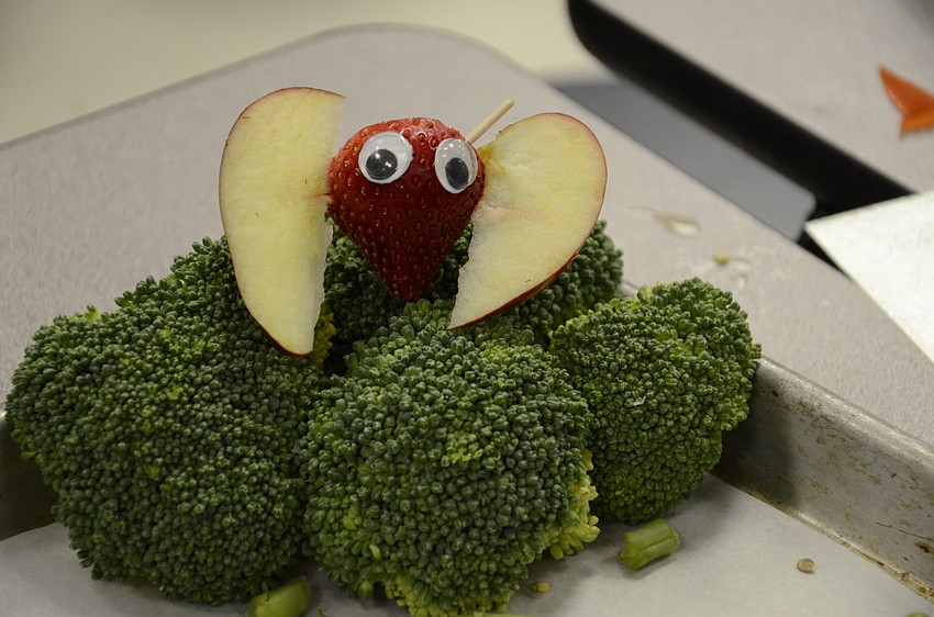 One team made a butterfly from a strawberry and apple slices.