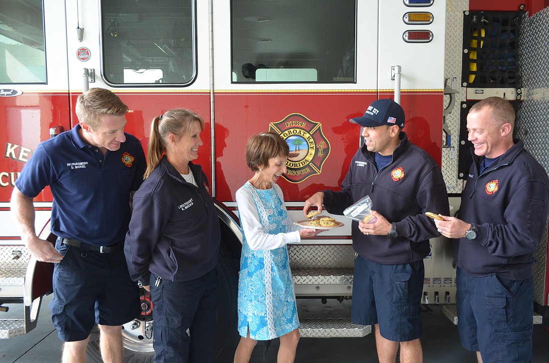 Maryann Mazzaferro, center, delivers cookies to firefighter/paramedic Denny Bickel, Lieutenant Kerri Brooks, and firefighter/paramedics Jose Rivera and Todd Mortenson, of the Longboat Key Fire Rescue