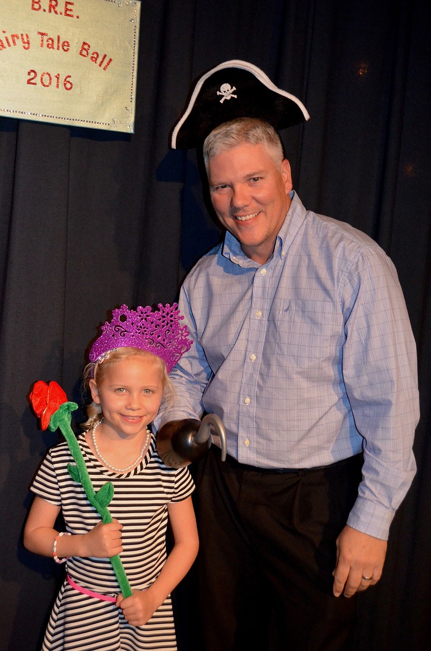 Caitlin and Brien Motherway find the photo booth and pose as a princess and a pirate.