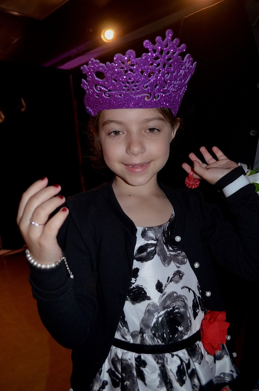 Leah Hegemier picks out her costume to wear in the photo booth.