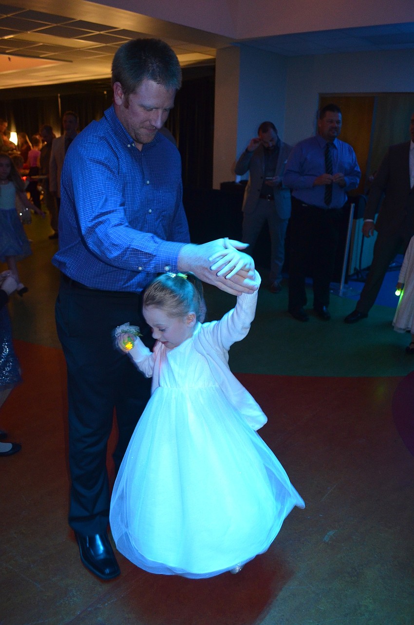 Kyle Giella twirls Kara Nickens around the dance floor.