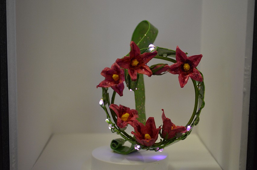 A miniature floral arrangement by Carol Malott was inspired by the Sarasota Opera House.