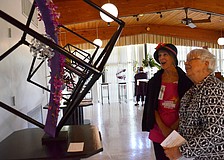 Page Jackson and Esther Swett admire the arrangement by Barbara Rao